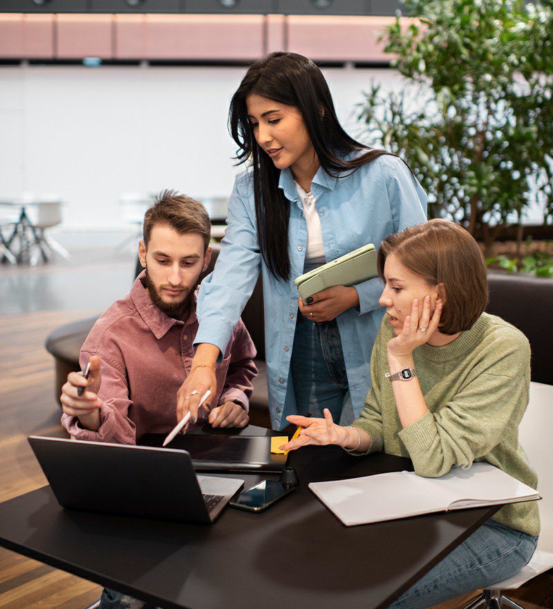 Defcor IT Systems team discussing business technology solutions